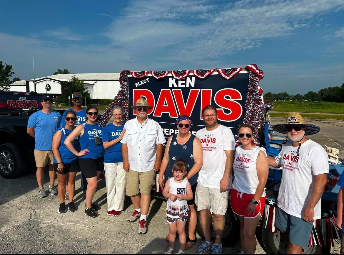 Ken Davis with family and volunteers in front of the campaign parade float